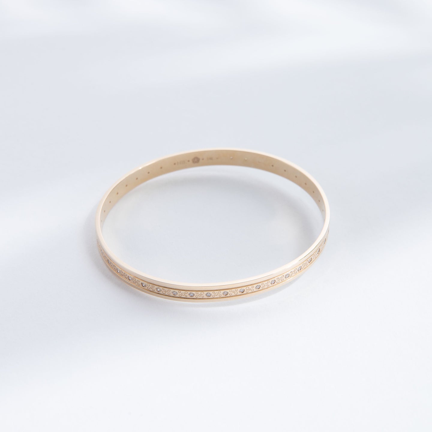 Hie Tutu Leslie gold bangle bracelet with engraved pattern and diamonds