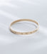 Hie Aloha Nui bangle bracelet in gold, engraved with the name Ana and including diamond accents