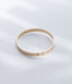 Hie Aloha Nui bangle bracelet in gold, engraved with the name Na'e and including diamond accents