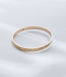 Hie Uluhe gold bangle bracelet with detailed engraving and diamonds